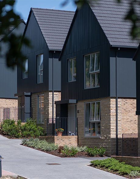 An external shot of Keld, with two detached houses beside one another.