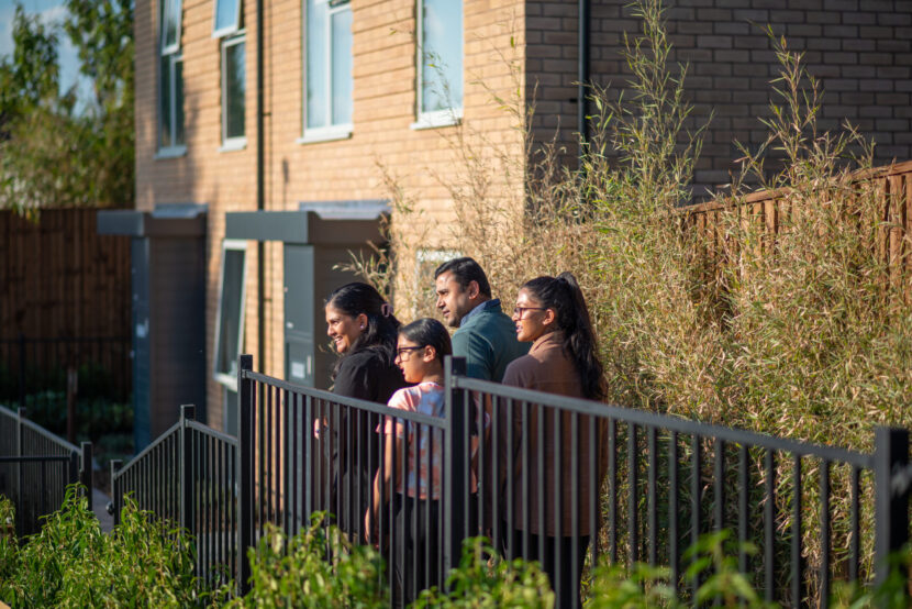 Family of four looking at the pedestrian-led street views