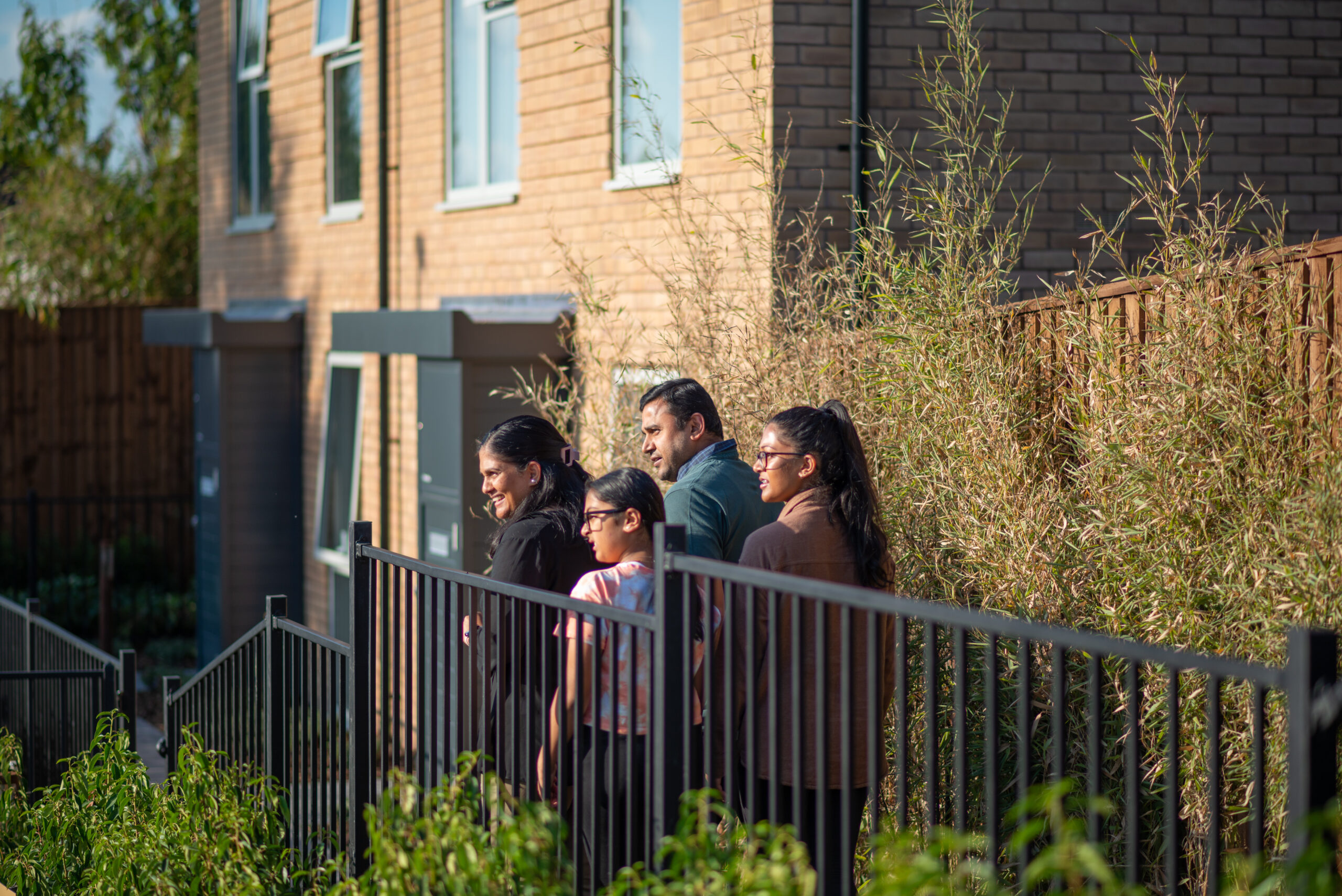 Family of four looking at the pedestrian-led street views